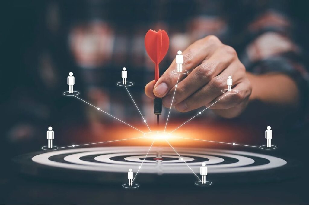 A diverse business team collaborating over growth strategies to achieve seamless sales-and-marketing-alignment.